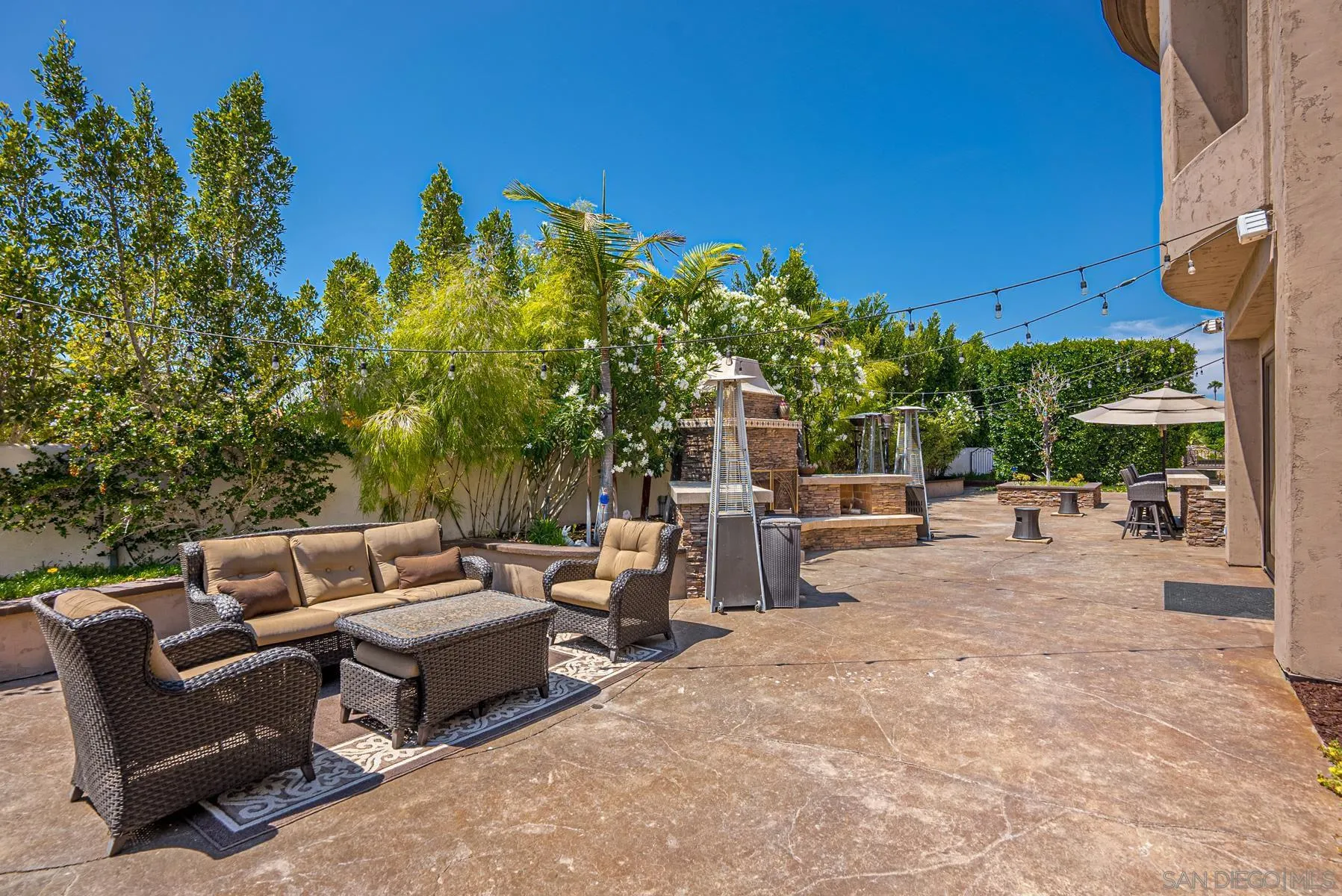 2871 Gate 3 Place Chula Vista, CA 91914 - Photo 68 of 73 a view of a patio with couches and table and chairs and potted plants