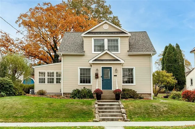 front view of a house with a yard