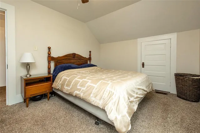 a bedroom with a bed and a closet