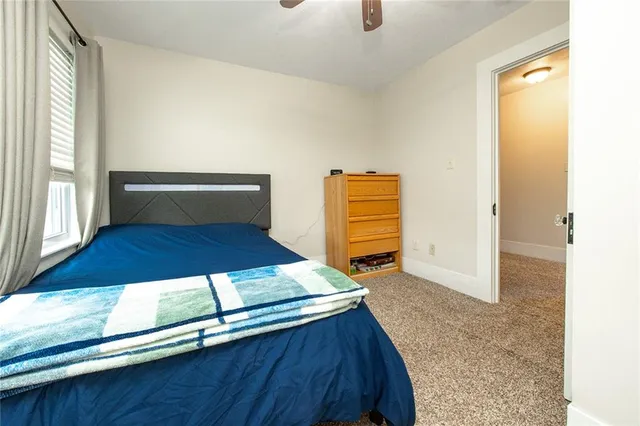 a view of kitchen cabinets and wooden floor