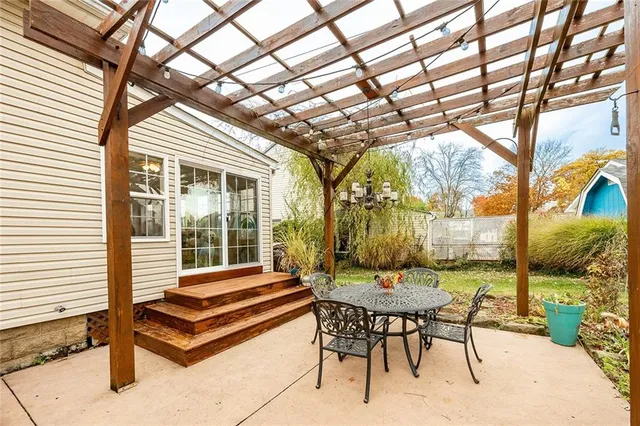 a backyard of a house with outdoor seating