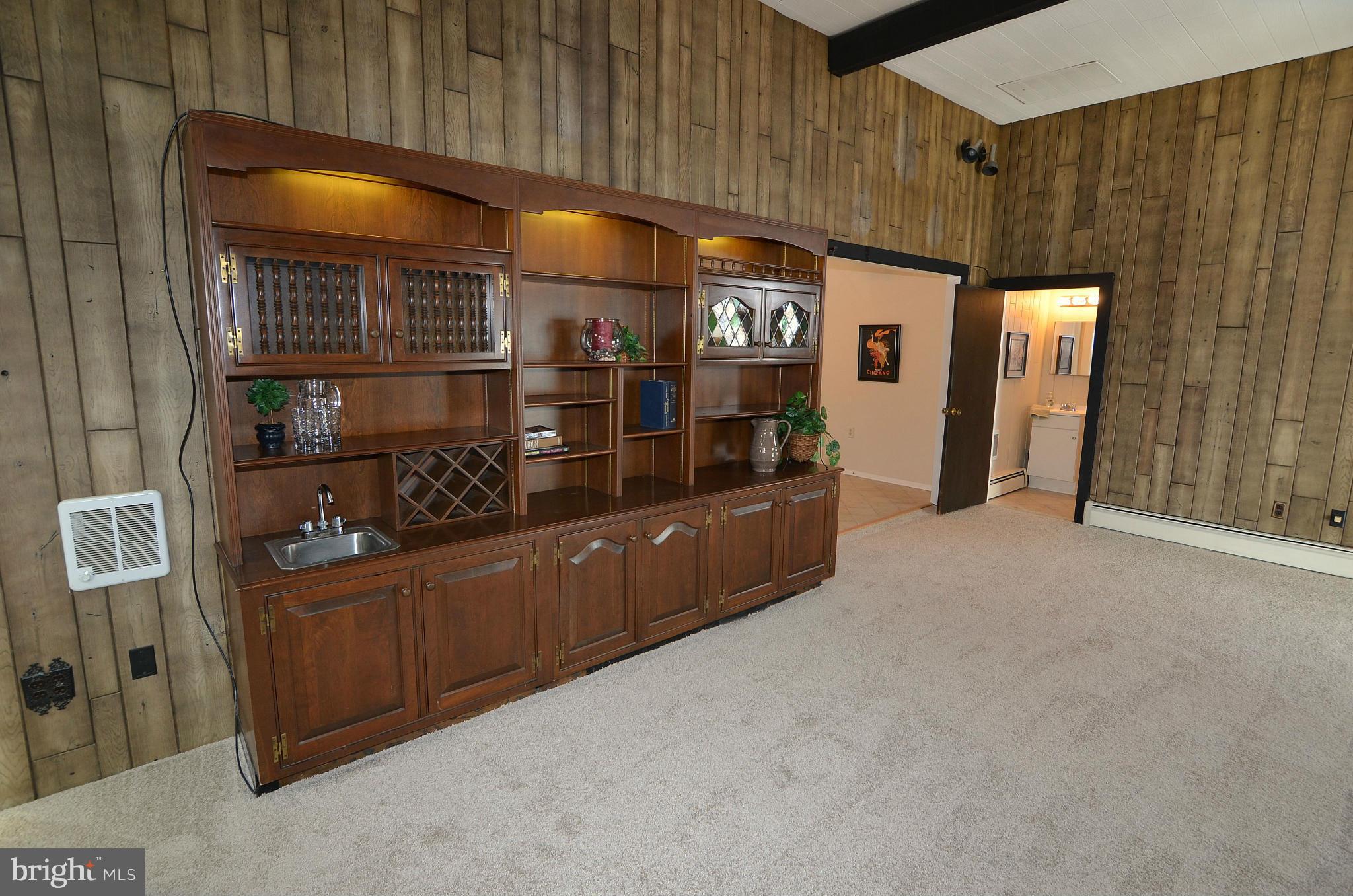 112 Thomas Road Glen Burnie, MD 21060 - Photo 16 of 30 a room with lot of cabinet and window
