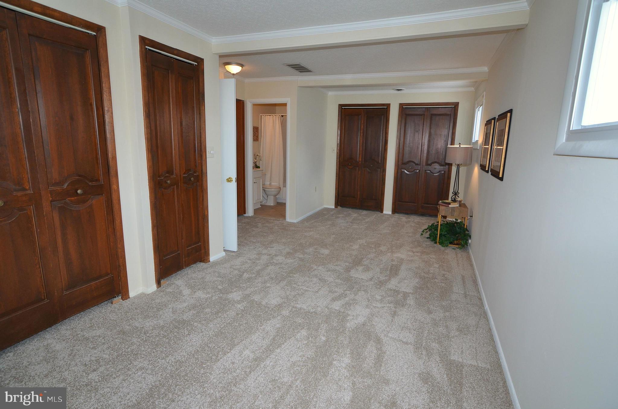 112 Thomas Road Glen Burnie, MD 21060 - Photo 24 of 30 a view of empty room with windows and wardrobe