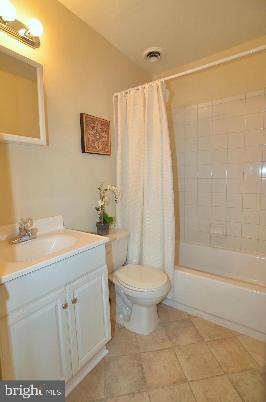 112 Thomas Road Glen Burnie, MD 21060 - Photo 26 of 30 a bathroom with a sink toilet and shower
