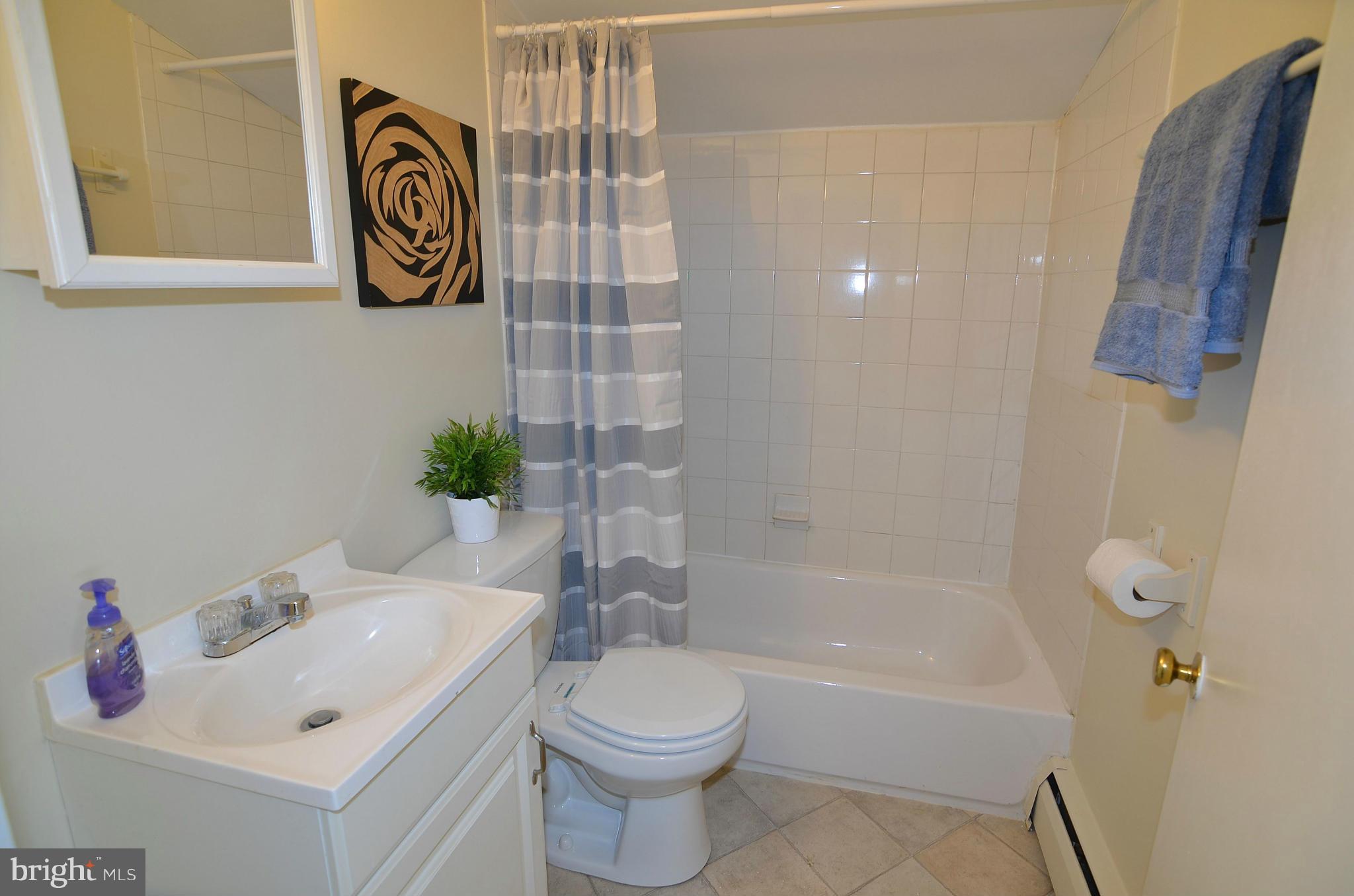 112 Thomas Road Glen Burnie, MD 21060 - Photo 29 of 30 a bathroom with a sink and a mirror