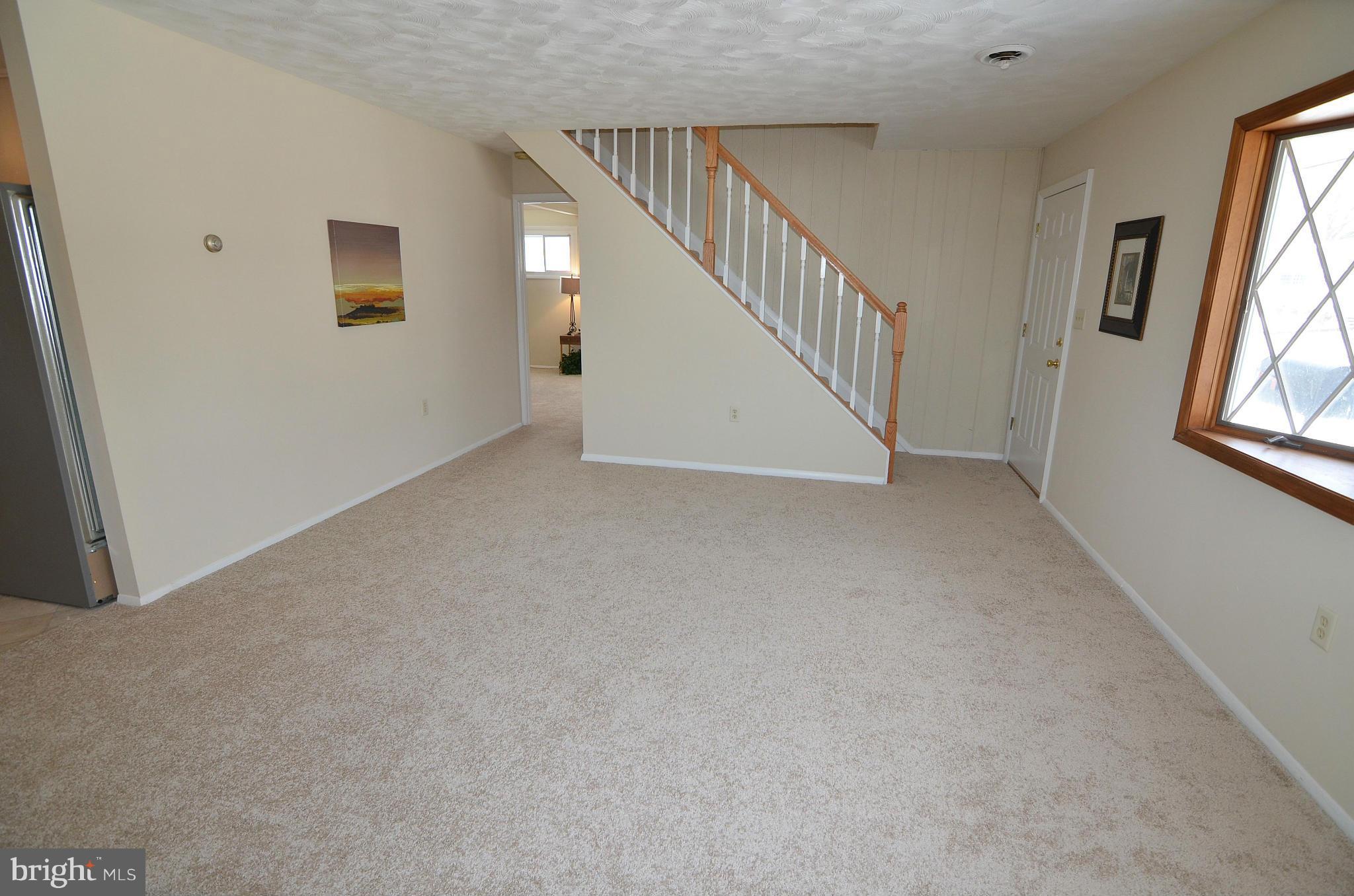 112 Thomas Road Glen Burnie, MD 21060 - Photo 5 of 30 a view of an empty room with a window