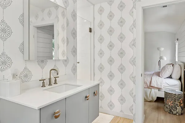 a bathroom with a sink toilet and shower