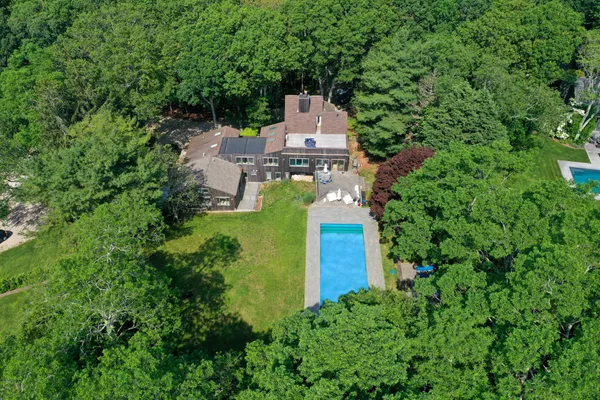an aerial view of a house with a garden