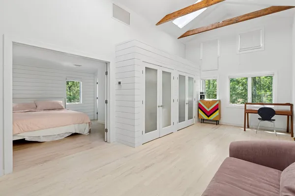 a bed room with a bed and a window