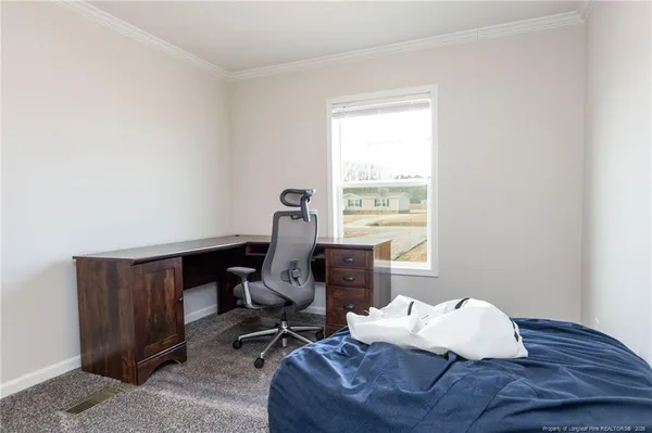 a workspace with furniture and a window