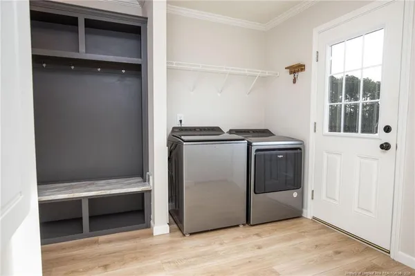 a utility room with washer and dryer