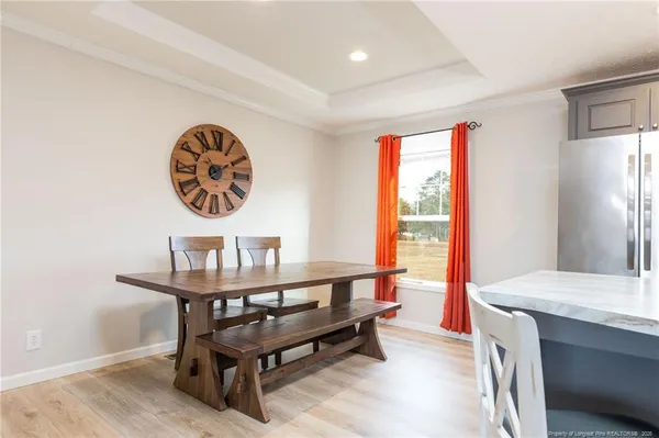 a view of a work space with furniture and window