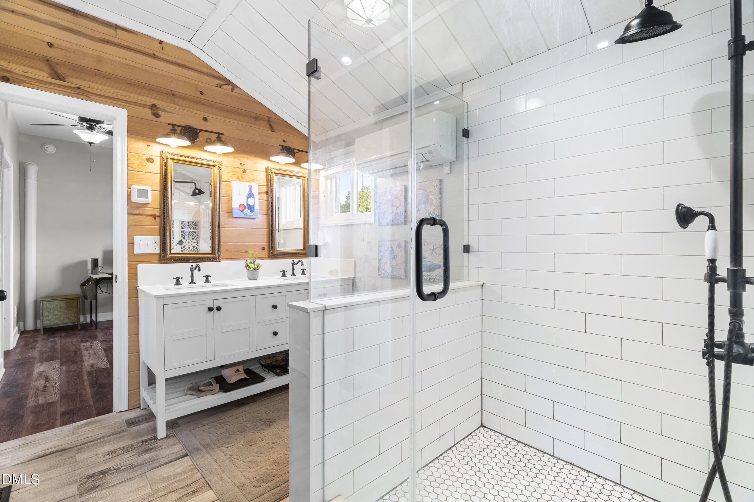 215 Old Stancil Road Kenly, NC 27542 - Photo 11 of 21 a bathroom with a shower a sink a mirror and shower