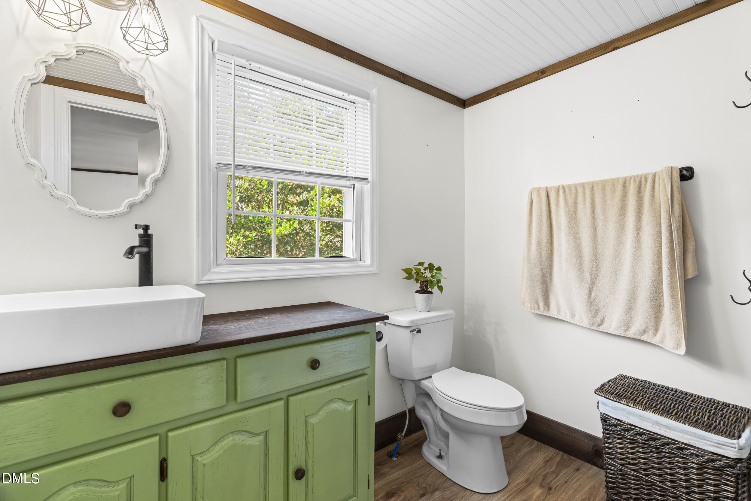 215 Old Stancil Road Kenly, NC 27542 - Photo 14 of 21 a bathroom with a sink a toilet and window