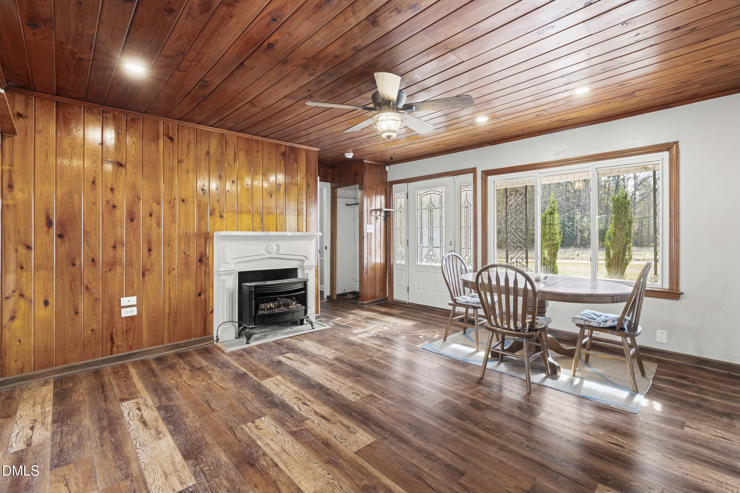 215 Old Stancil Road Kenly, NC 27542 - Photo 2 of 21 a view of livingroom with furniture a fireplace and wooden floor