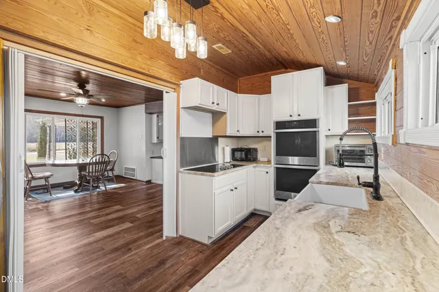 a kitchen with refrigerator and stove