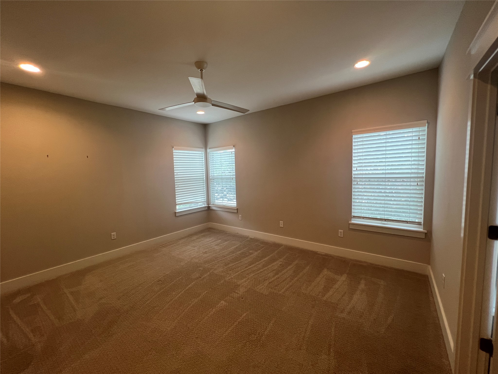 6515 Davis Lane, Unit 10 Austin, TX 78749 - Photo 12 of 22 A quiet retreat with recessed lighting and two large windows offering ample natural illumination.