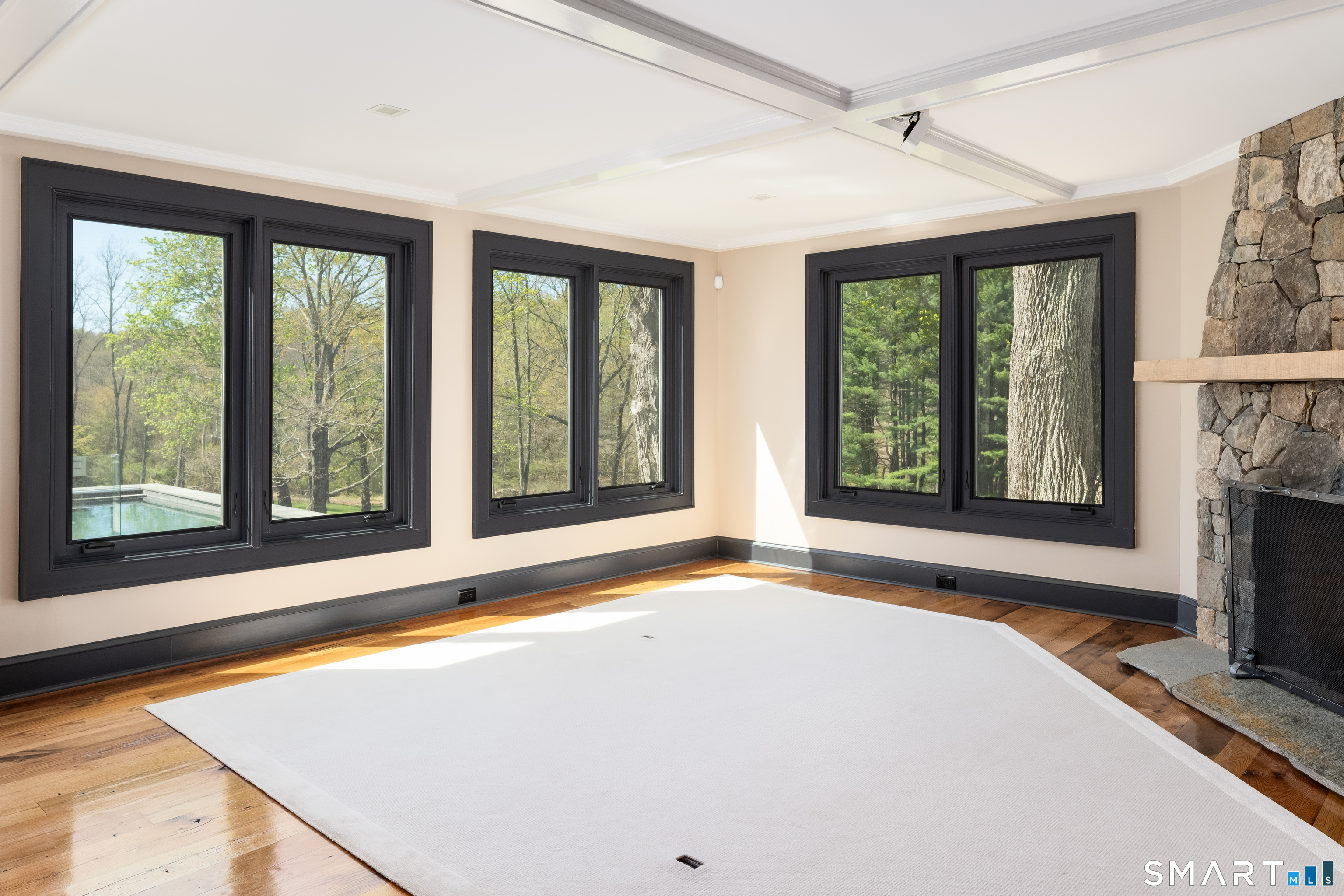 155 Long Ridge Road Danbury, CT 06810 - Photo 20 of 40 Adjacent to the kitchen, the family room opens as an informal gathering space centered on the fireplace and views.