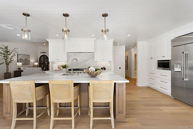 a kitchen with a stove and a sink
