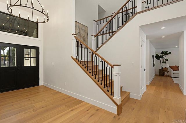 a view of white cabinets and a wooden floor