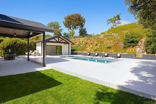 an aerial view of a house with yard