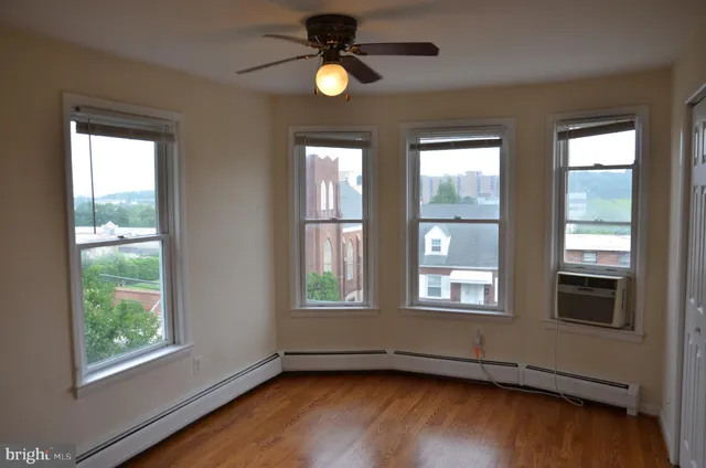 a view of an empty room with a fan