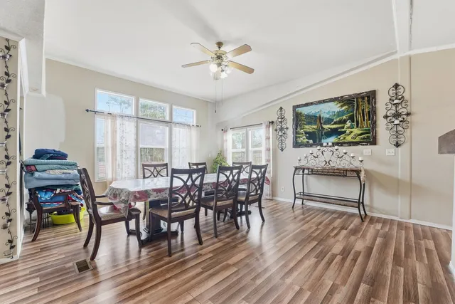 a dining room with furniture garden view and a chandelier
