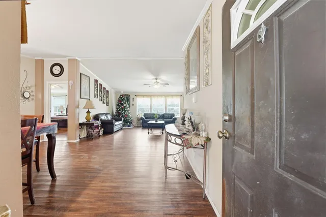 a view of a livingroom with furniture and hardwood floor