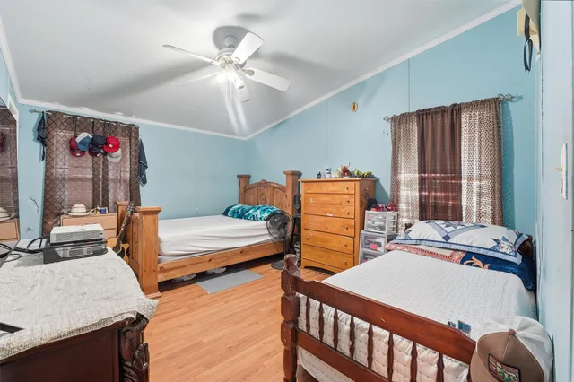 a bedroom with a bed and dresser