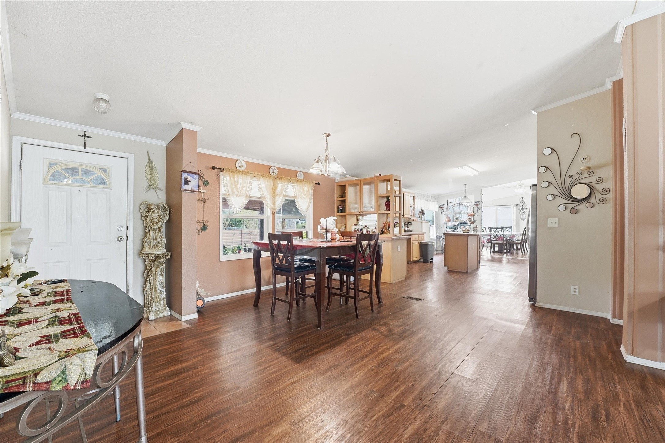 1017 Woodland Street Channelview, TX 77530 - Photo 10 of 25 a view of a a dining room with furniture window and wooden floor