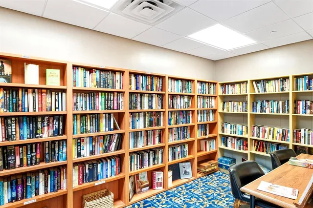a view of a livingroom with a bookshelf