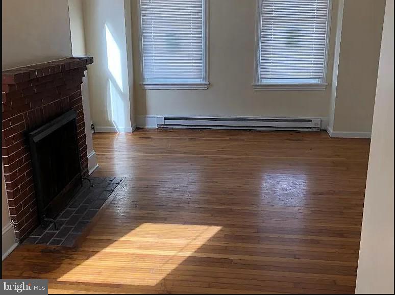 228 East Main Street Elkton, MD 21921 - Photo 12 of 29 a view of empty room with wooden floor and fan
