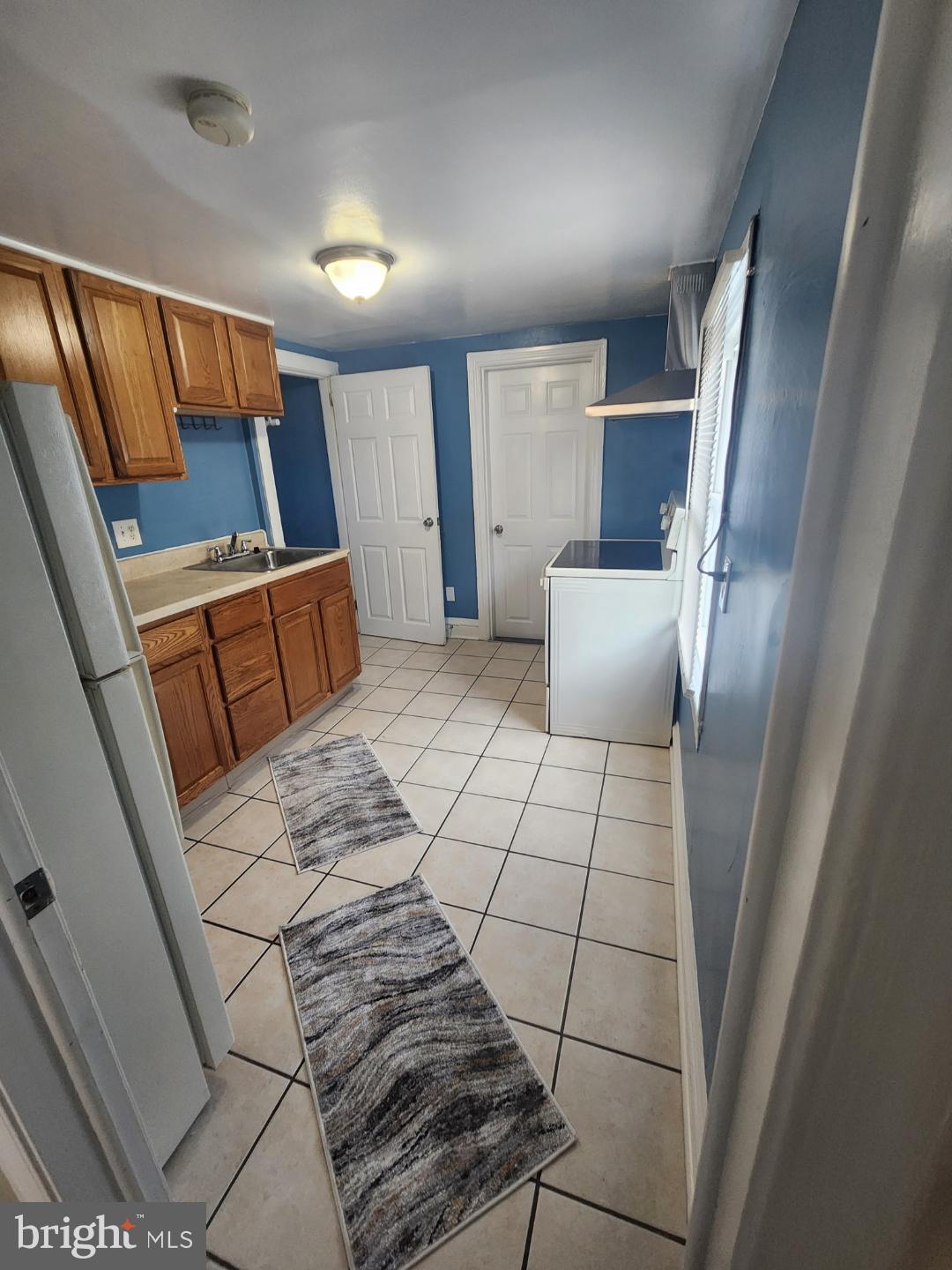228 East Main Street Elkton, MD 21921 - Photo 16 of 29 a view of wooden floor in a hall with a sink