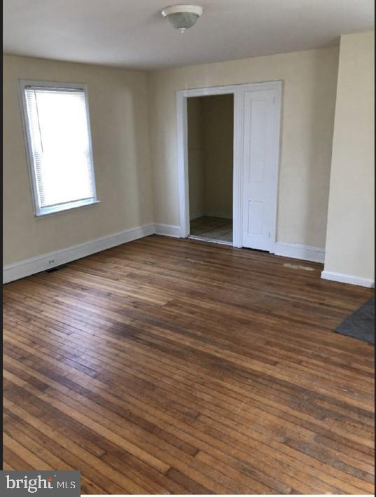 228 East Main Street Elkton, MD 21921 - Photo 9 of 29 an empty room with wooden floor and windows