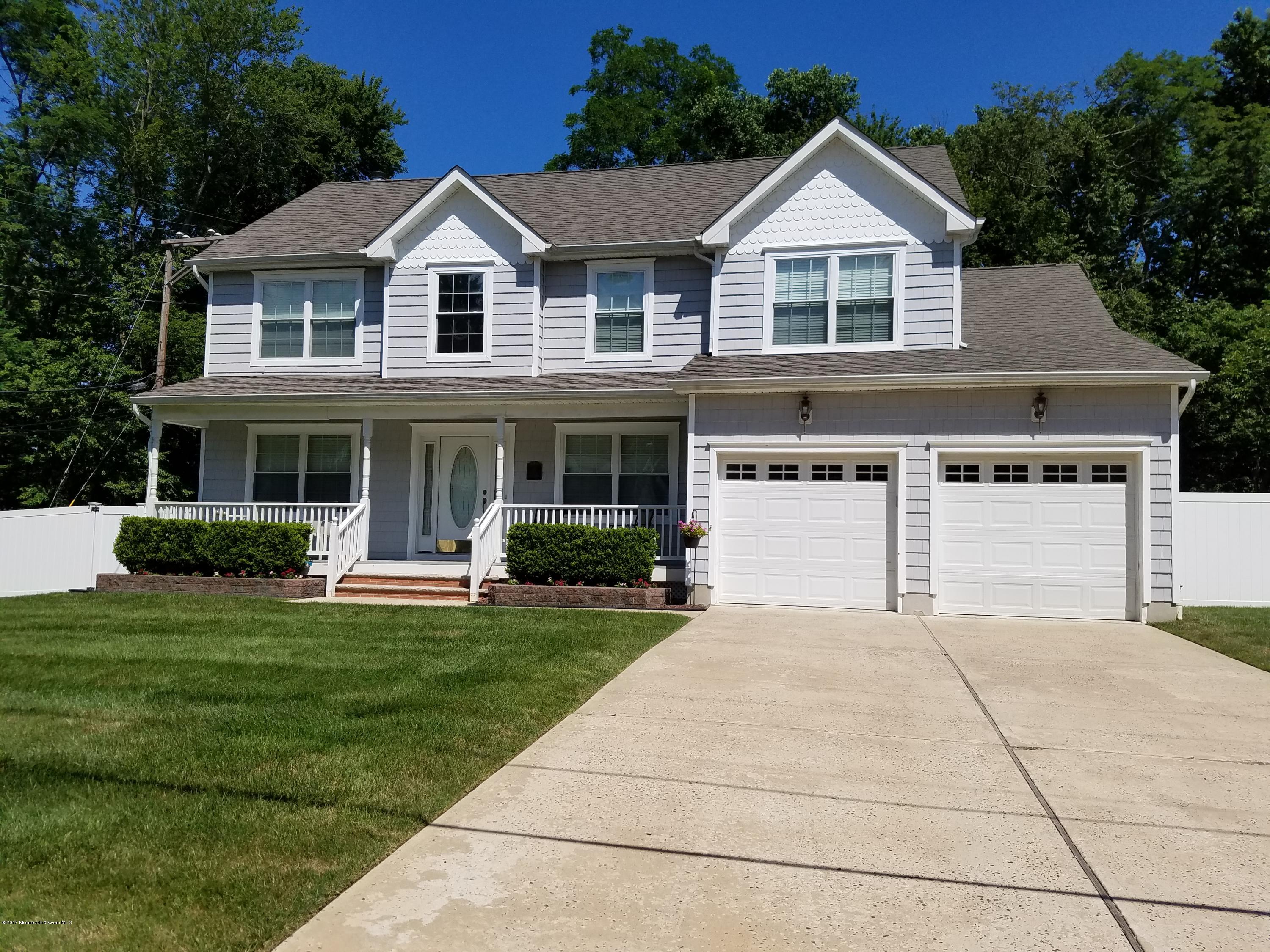 126 Robin Road Neptune Township, NJ 07753 - Photo 1 of 24 front view of a house with a yard