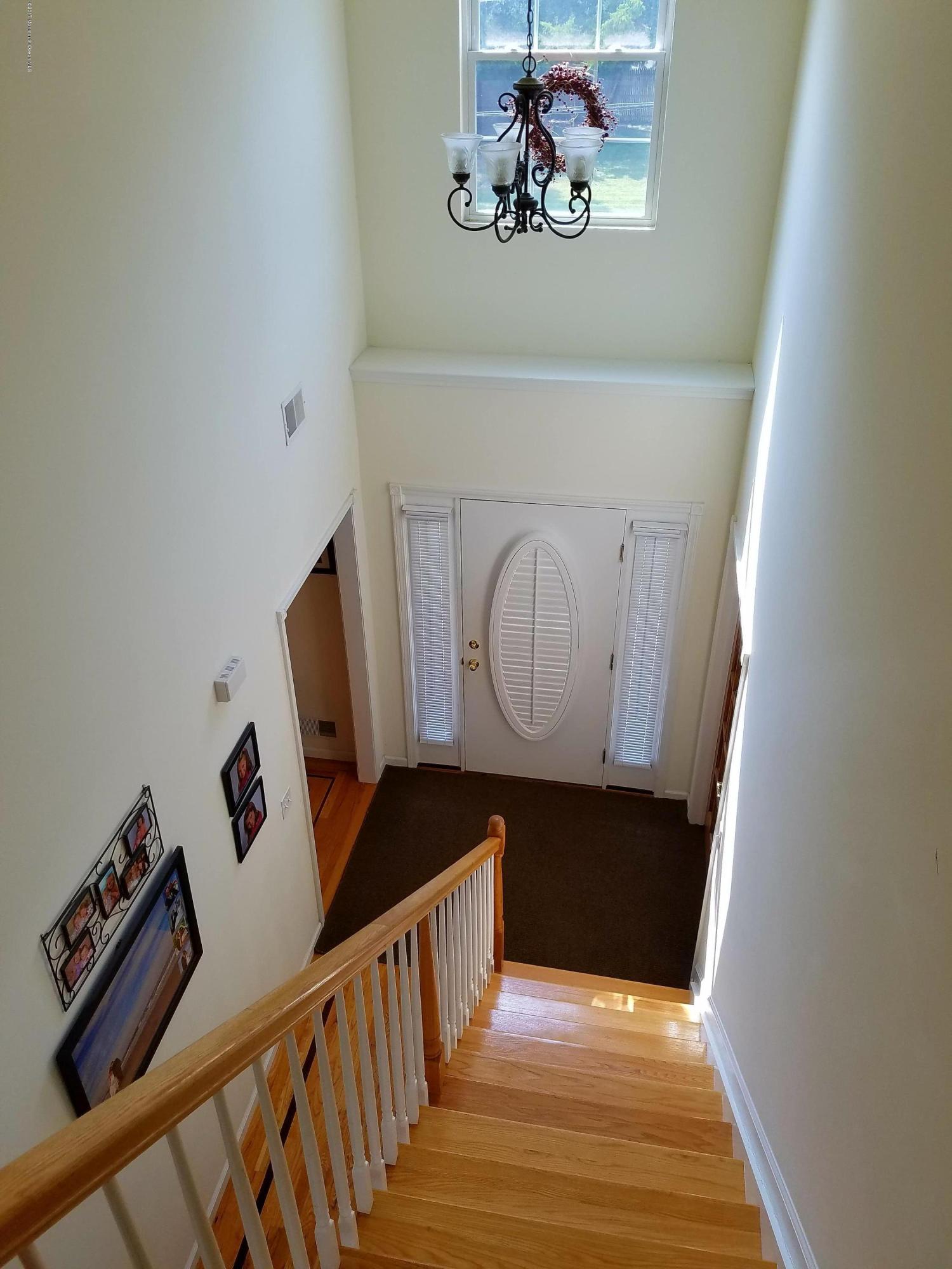 126 Robin Road Neptune Township, NJ 07753 - Photo 13 of 24 a view of stairs and with wooden floor