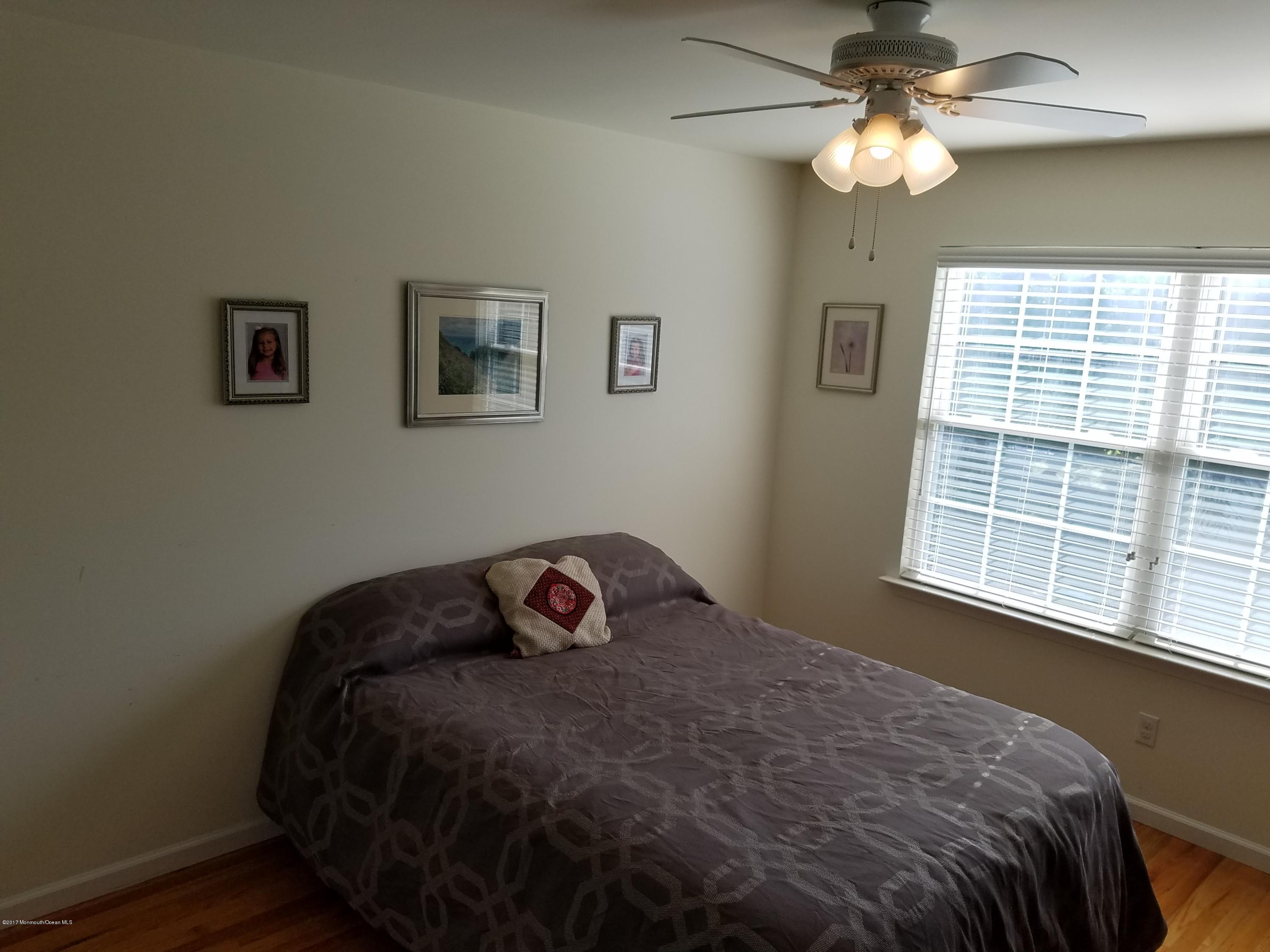 126 Robin Road Neptune Township, NJ 07753 - Photo 23 of 24 a bedroom with a bed and a window