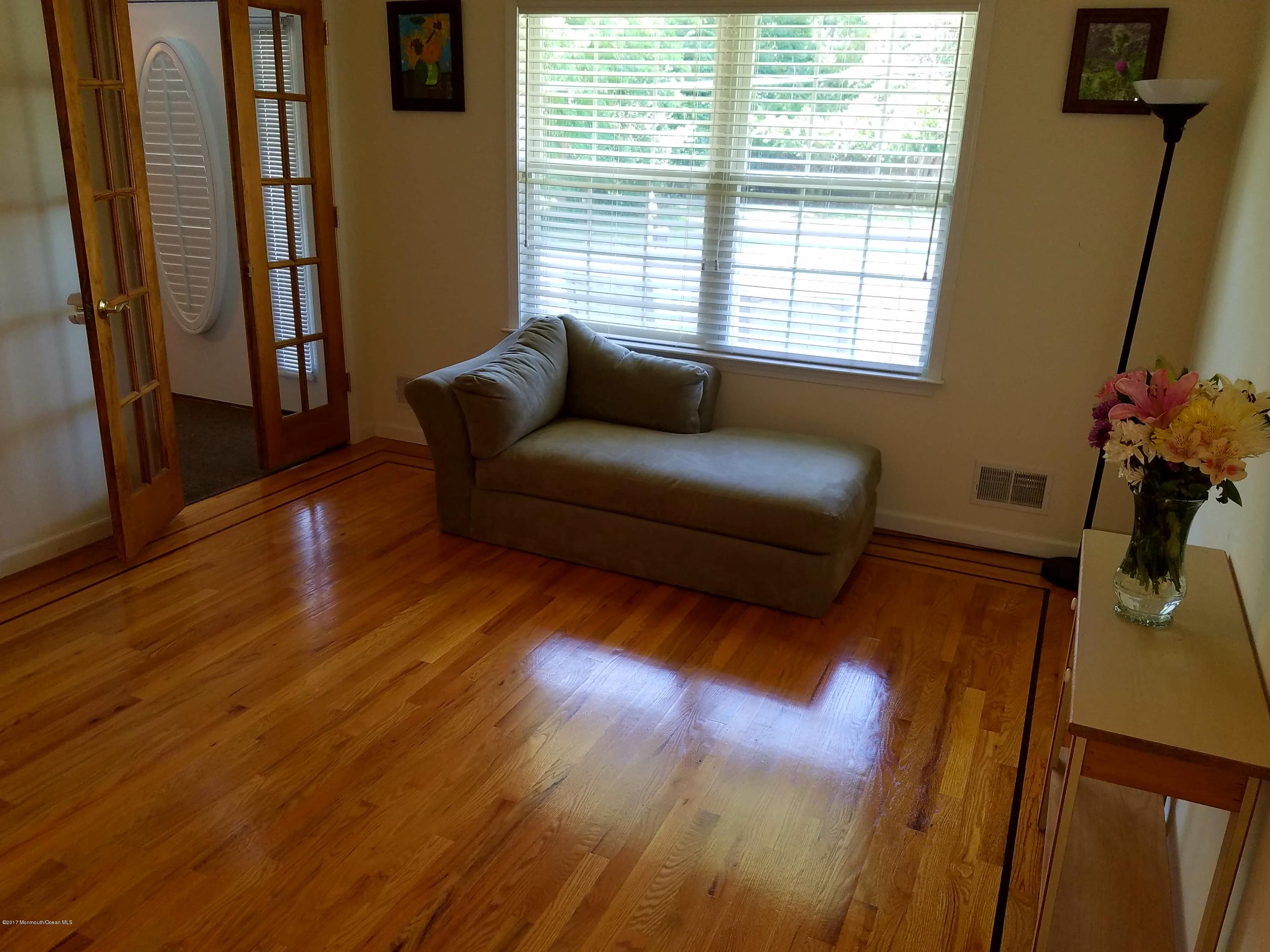 126 Robin Road Neptune Township, NJ 07753 - Photo 10 of 24 a living room with furniture and a flat screen tv