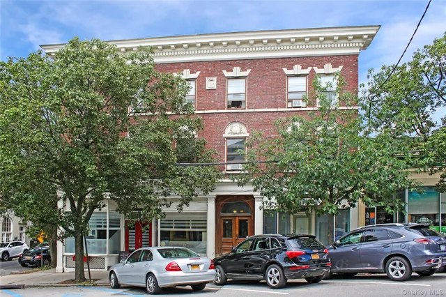 a view of a car parked in front of a building