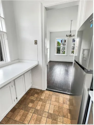 a view of an empty room with windows