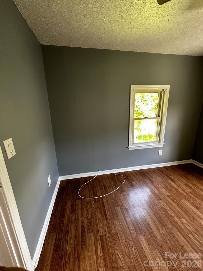 435 Davis Street Albemarle, NC 28001 - Photo 16 of 30 a view of empty room with wooden floor