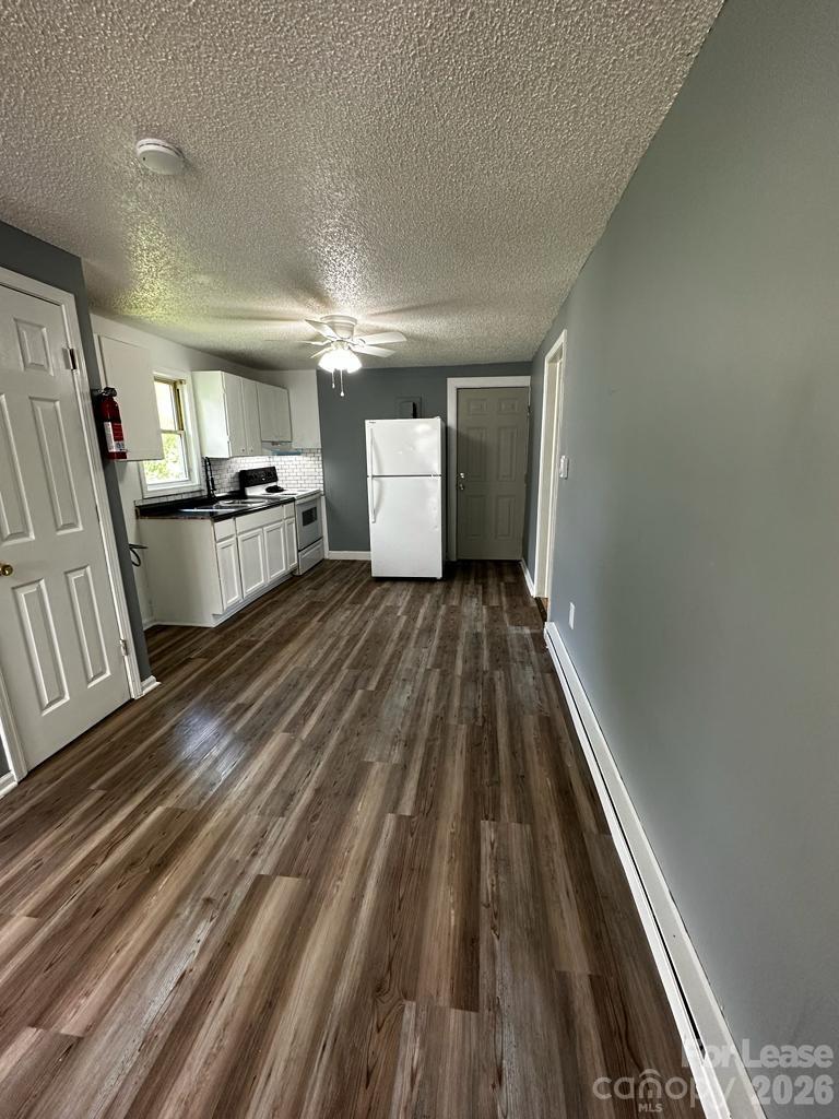 435 Davis Street Albemarle, NC 28001 - Photo 18 of 30 a view of a room with wooden floor and staircase