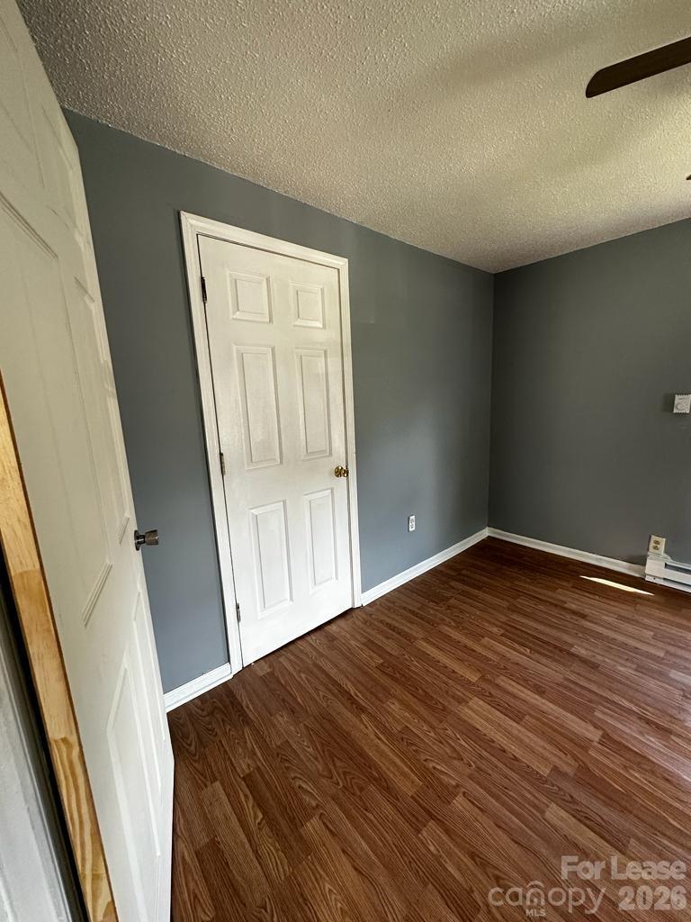435 Davis Street Albemarle, NC 28001 - Photo 20 of 30 a view of empty room with wooden floor