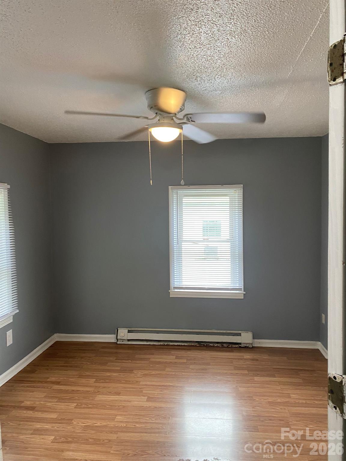 435 Davis Street Albemarle, NC 28001 - Photo 25 of 30 a view of a room with wooden floor and a window