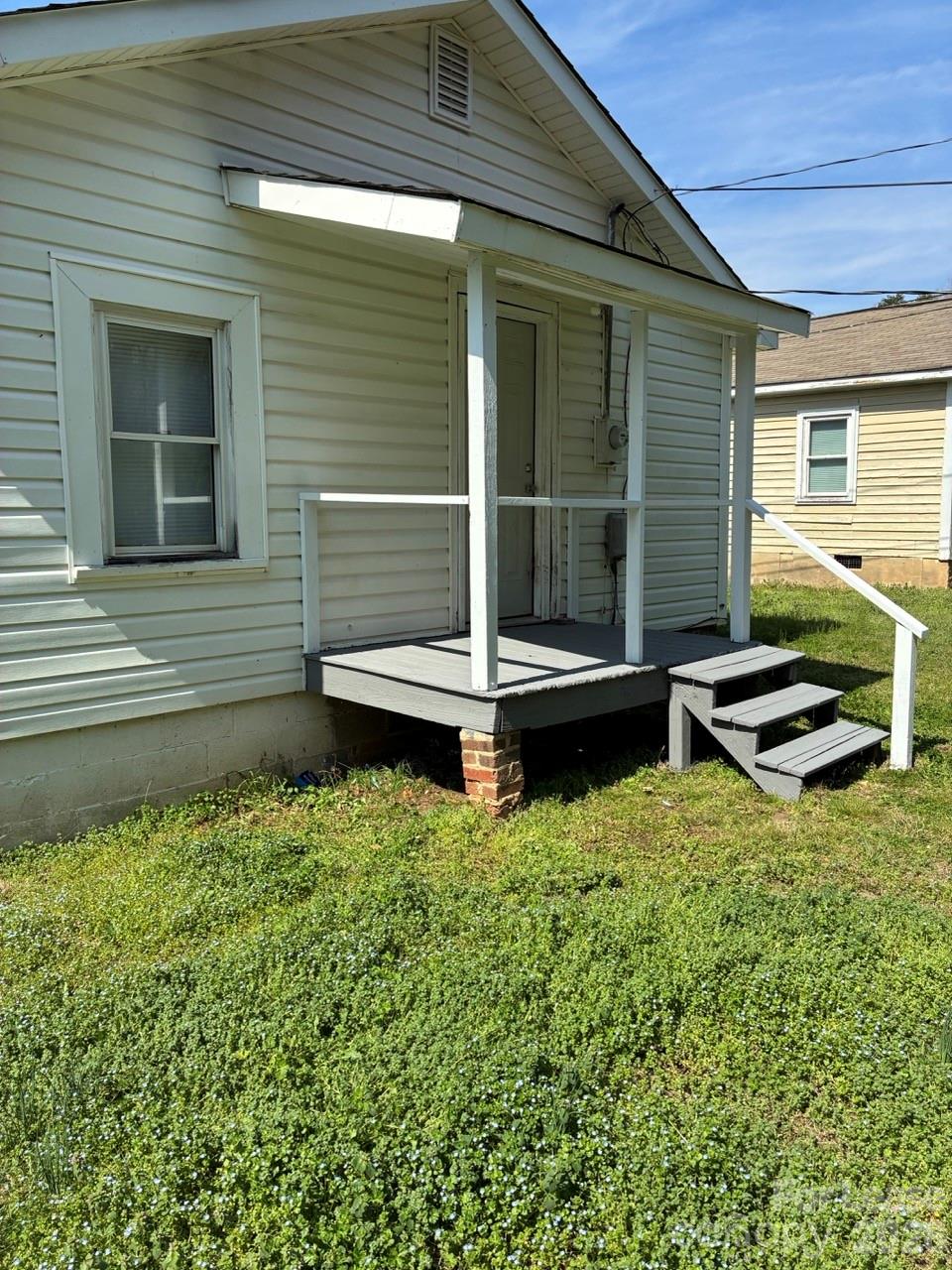 435 Davis Street Albemarle, NC 28001 - Photo 26 of 30 a backyard of a house with wooden floor and fence