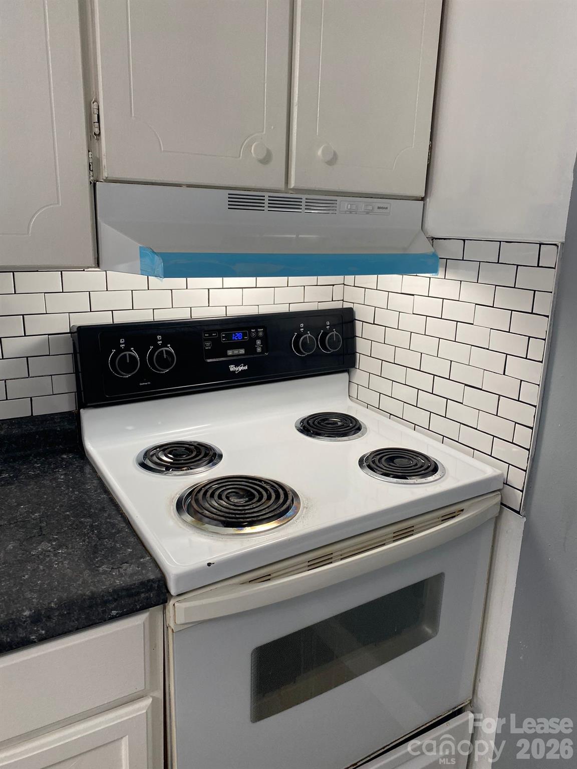 435 Davis Street Albemarle, NC 28001 - Photo 3 of 30 a stove top oven sitting inside of a kitchen
