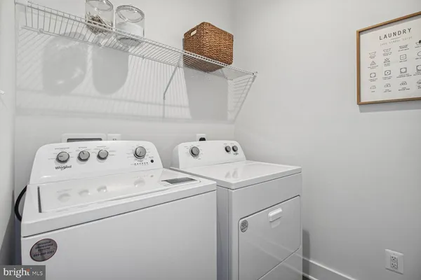 a bathroom with a sink toilet and a mirror