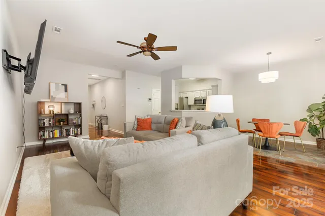 a large room with a lot of bed and couch