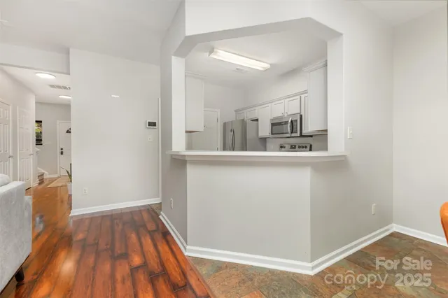 a view of a kitchen from the hallway