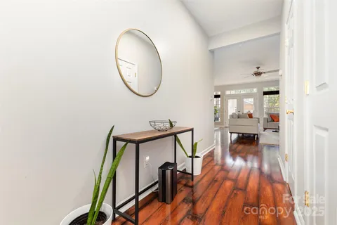 a view of a livingroom with furniture and wooden floor
